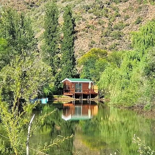 Chalet with balcony and with water view