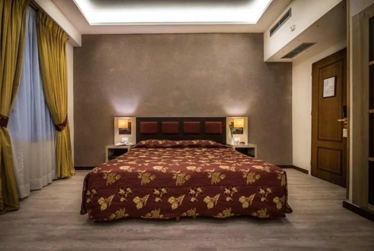 Executive Quadruple room with balcony and with city view
