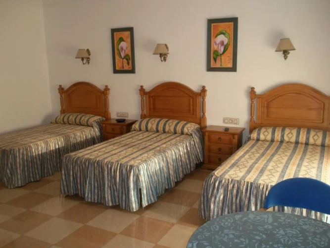 Standard Triple room with garden view