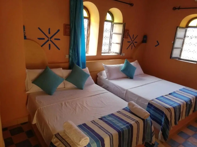 Standard Quadruple room with garden view