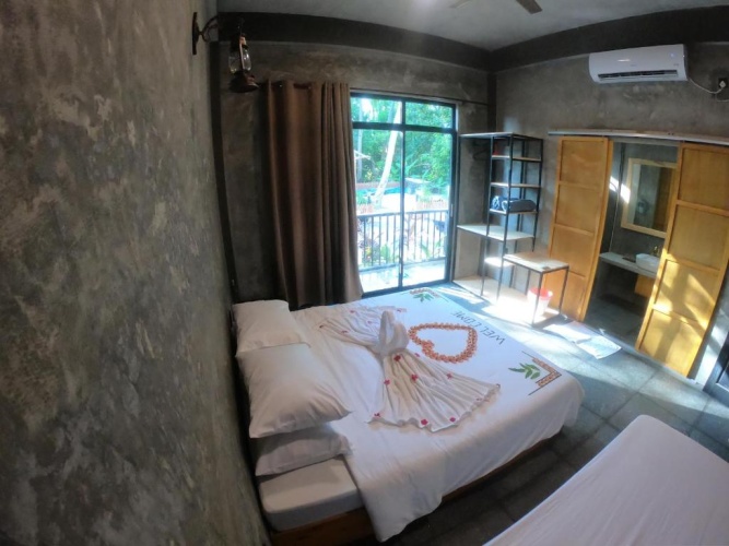 Standard Triple room with garden view