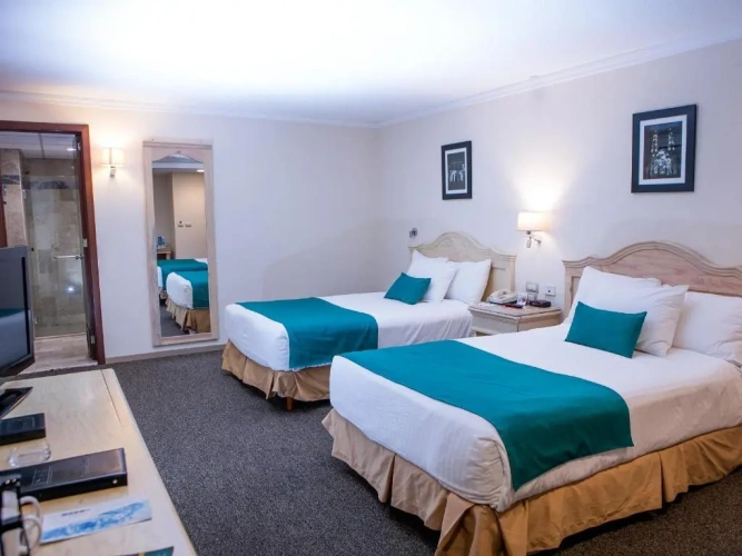 Standard Triple room with courtyard view