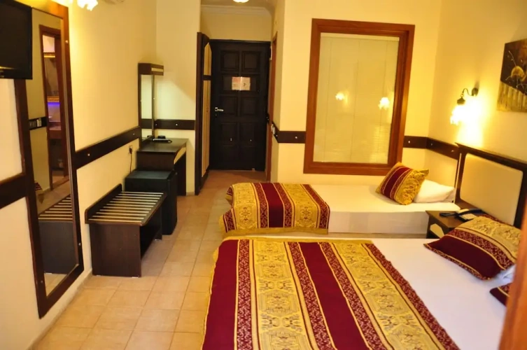 Standard Triple room with balcony and with garden view