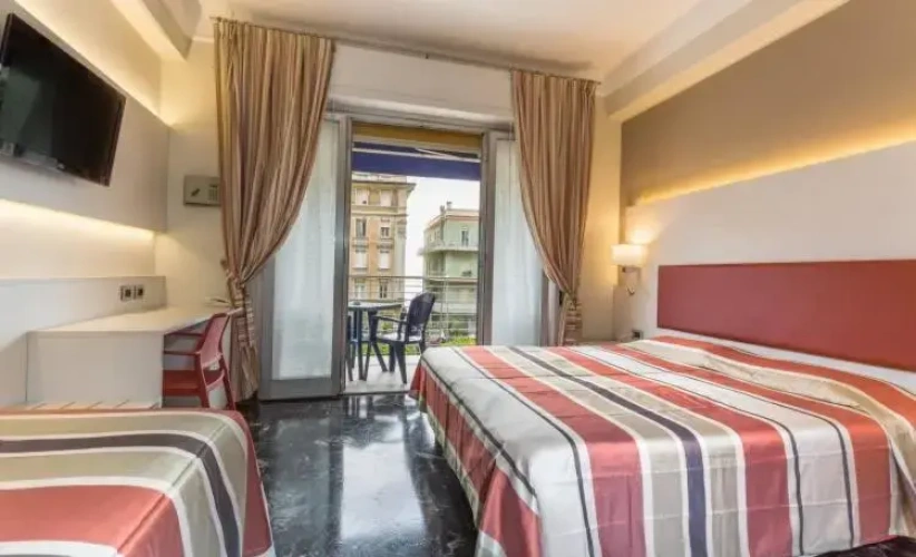 Standard Quadruple room with balcony and with garden view