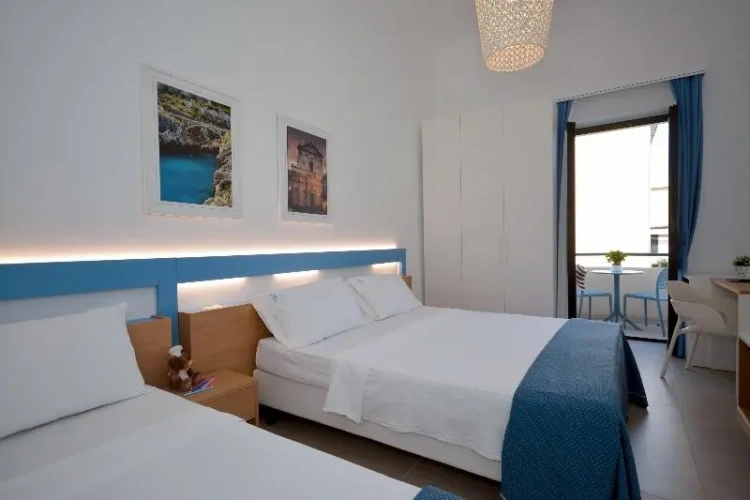 Standard Triple room with balcony and with lateral sea view