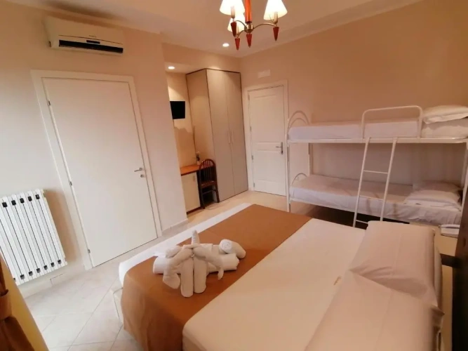 Standard Quadruple room with balcony and with garden view