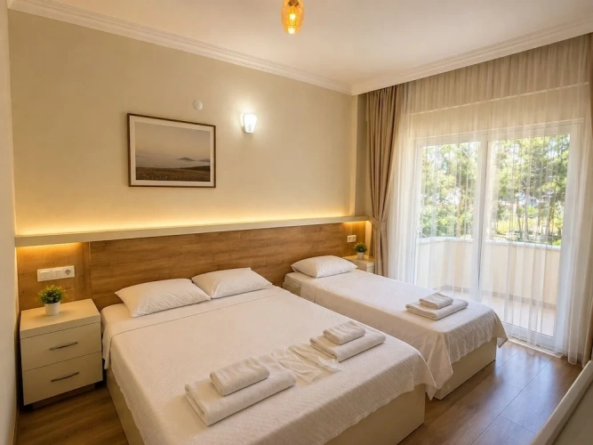 Standard Triple Family room with balcony and with garden view