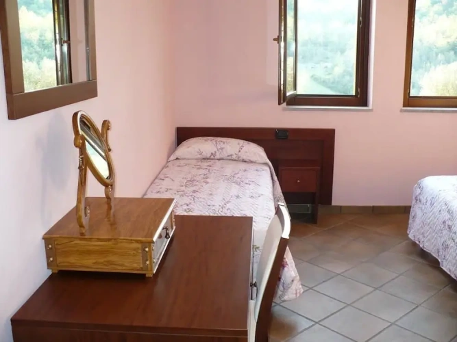Standard Triple room with garden view
