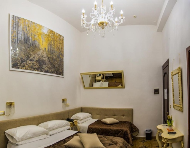 Deluxe Quadruple room with balcony