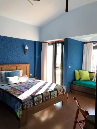 Luxury Triple room with balcony and with garden view
