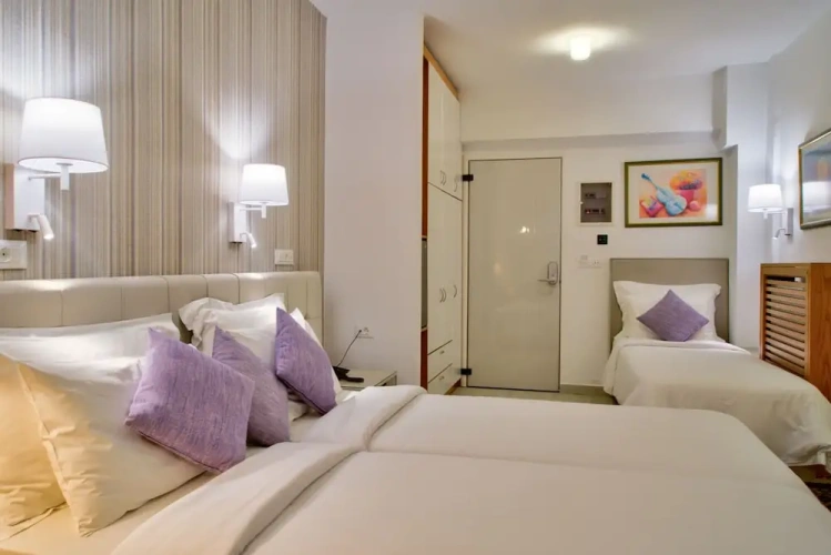 Standard Triple room with balcony and with garden view