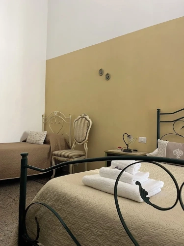 Standard Quadruple Family room with balcony and with courtyard view