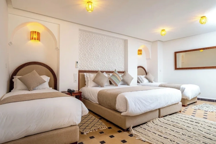 Standard Quadruple Family room with courtyard view
