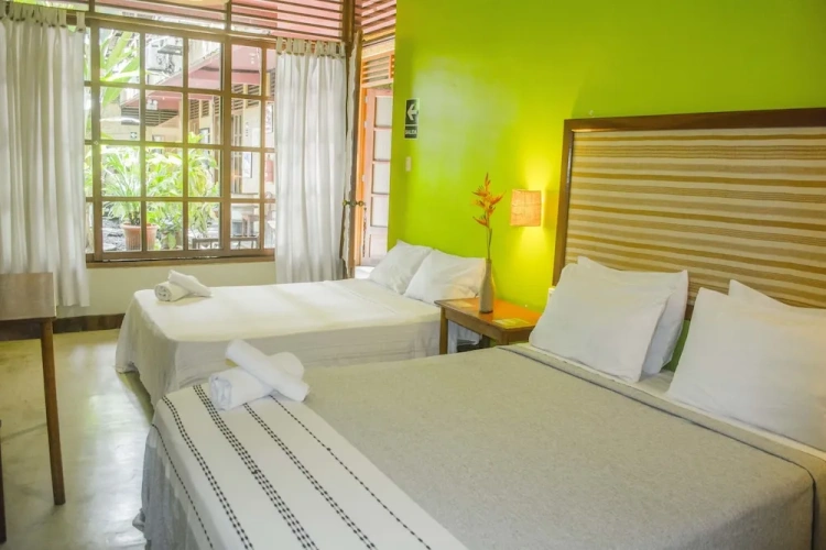 Standard Triple room with balcony and with garden view