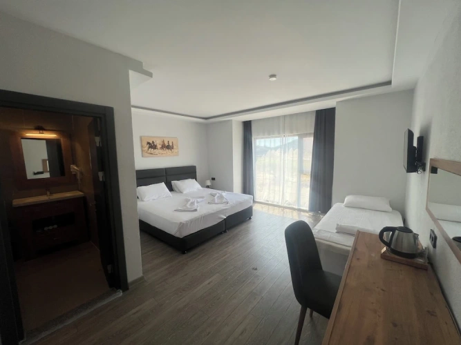 Standard Triple room with garden view