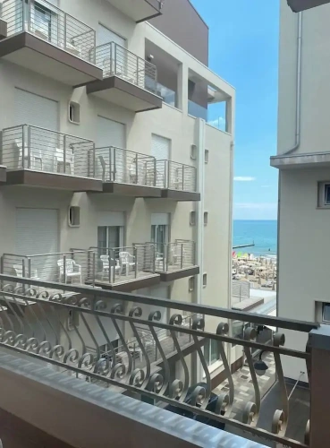 Standard Quadruple room with balcony and with partial sea view
