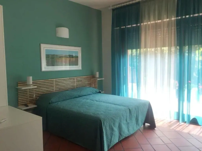 Standard Triple room with garden view