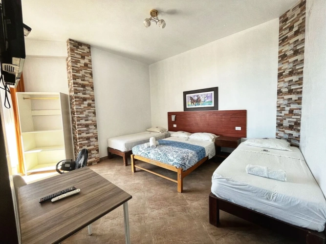 Standard Quadruple Family room with balcony and with pool view