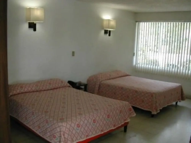 Standard Quadruple room with balcony and with garden view