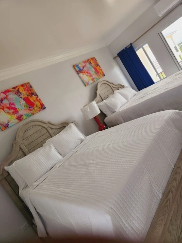 Deluxe Quadruple room with balcony and with garden view
