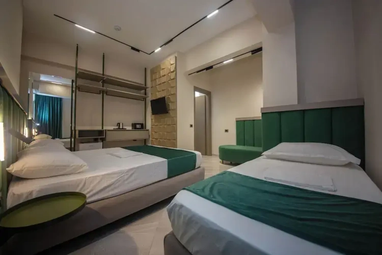 Superior Triple room with balcony and with partial sea view