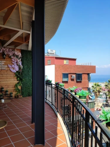 Standard Quadruple Family room with balcony and with partial ocean view