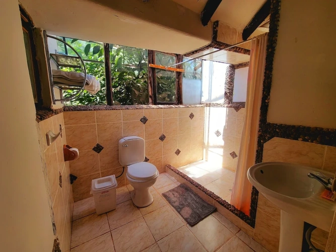 Standard Triple room with garden view