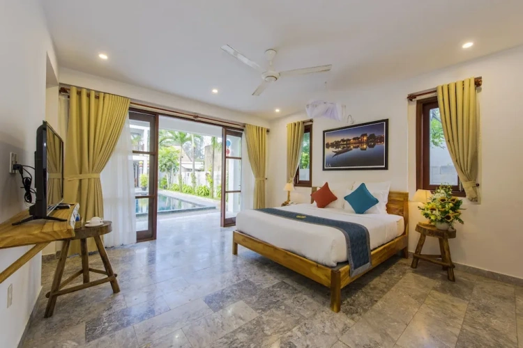 Standard Triple Family room with balcony and with garden view