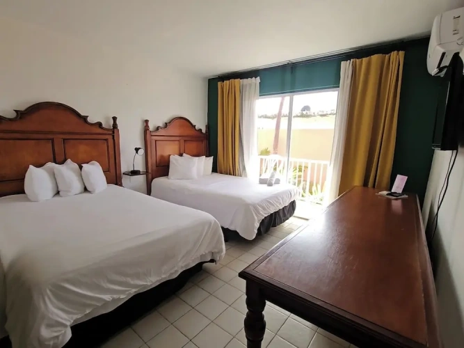 Deluxe Quadruple room with balcony and with garden view