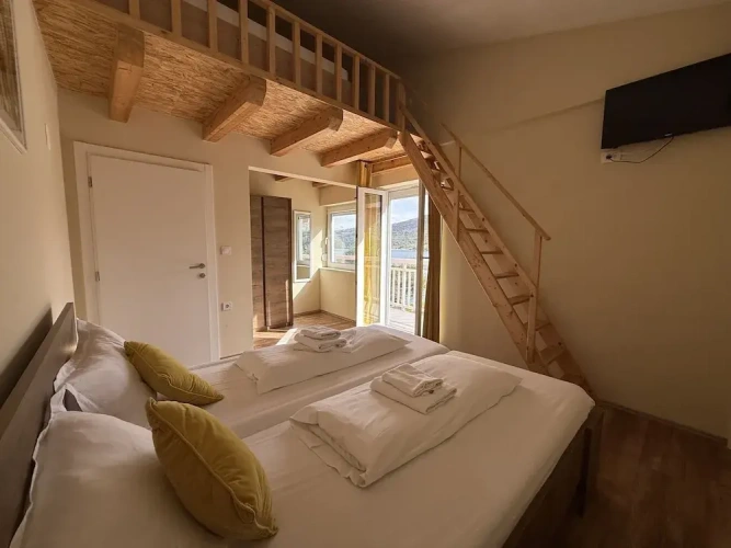 Standard Quadruple Family room with courtyard view