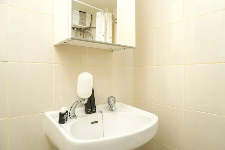 Simply White and Compact Studio at Amethyst Apartment