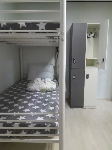 Bed in Dorm with courtyard view