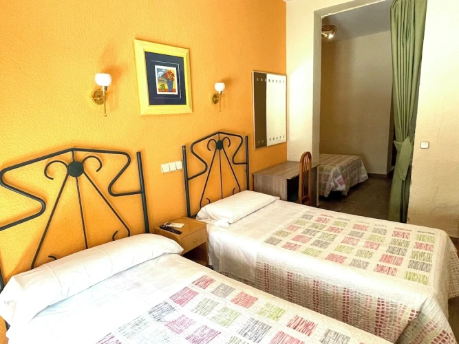 Standard Quadruple room with balcony and with city view