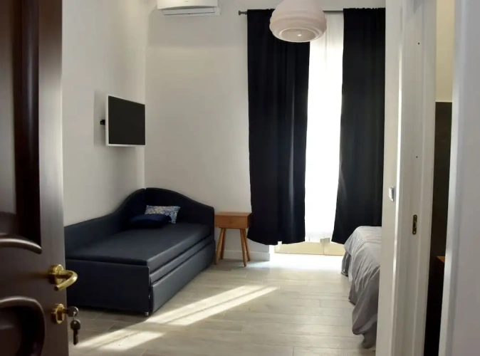 Deluxe Quadruple room with balcony