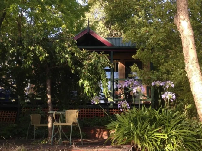 Cottage with balcony and with garden view
