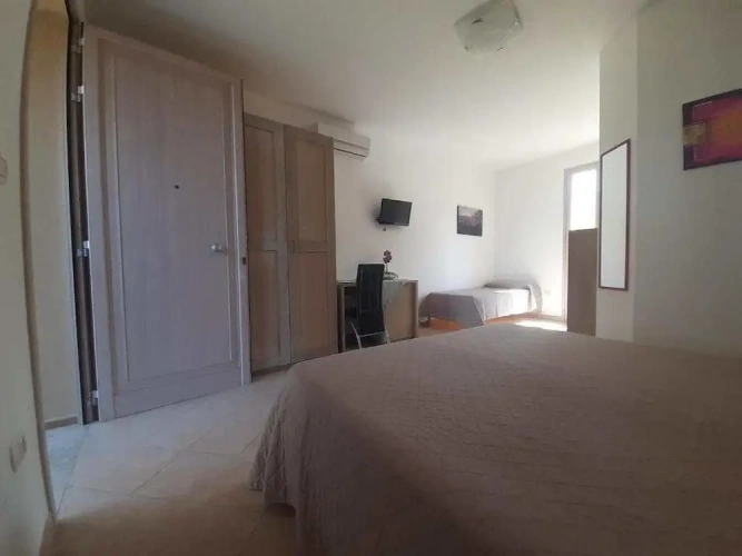 Standard Triple room with garden view