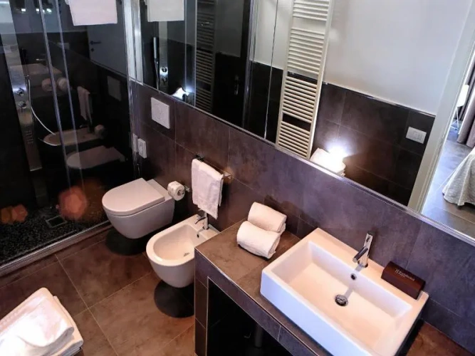 Standard Quadruple room with balcony and with partial sea view