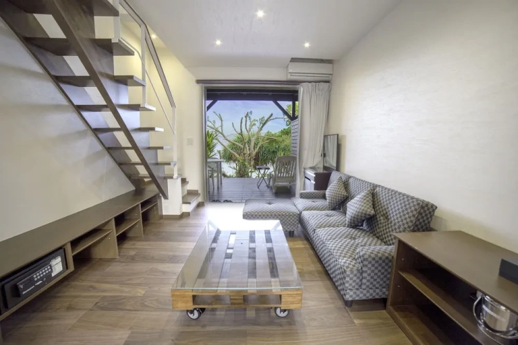 Comfort room with balcony and beachfront