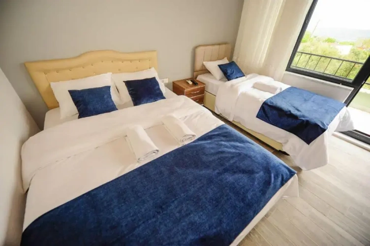 Standard Triple room with garden view
