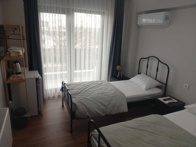 Standard Triple Family room with balcony and with garden view
