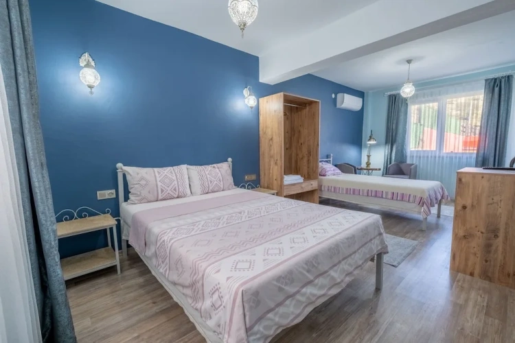 Standard Triple room with balcony and with garden view