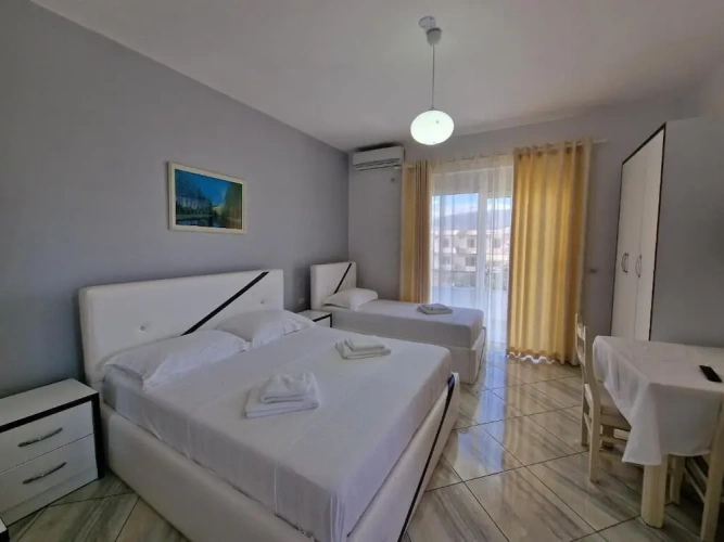 Standard Triple room with balcony and with garden view