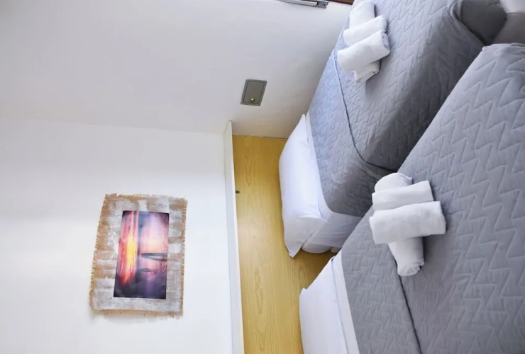 Comfort Quadruple room with balcony and with partial sea view