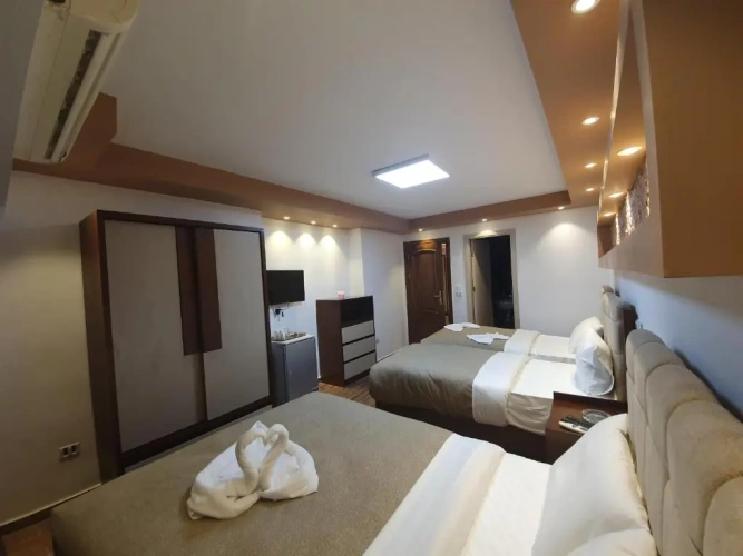 Standard Triple room with garden view