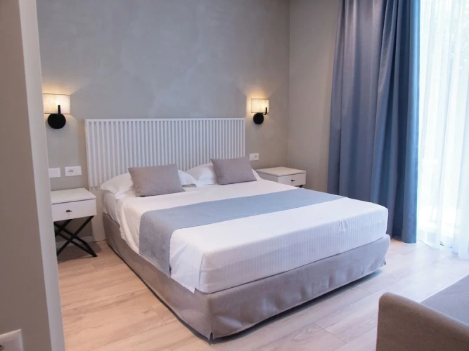 Classic Triple room with balcony and with garden view