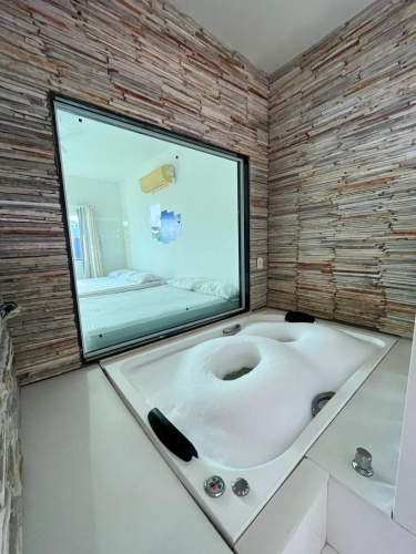 casa de praia com piscina e hidromassagem