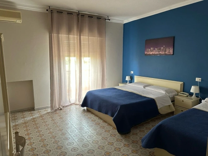Standard Triple room with balcony and with garden view