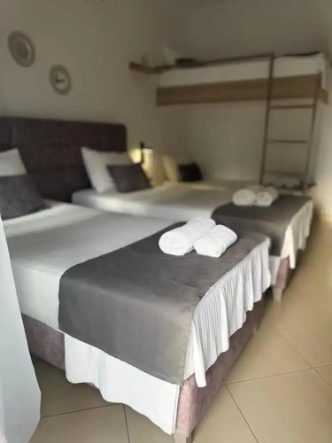 Standard Quadruple room with balcony and with partial sea view