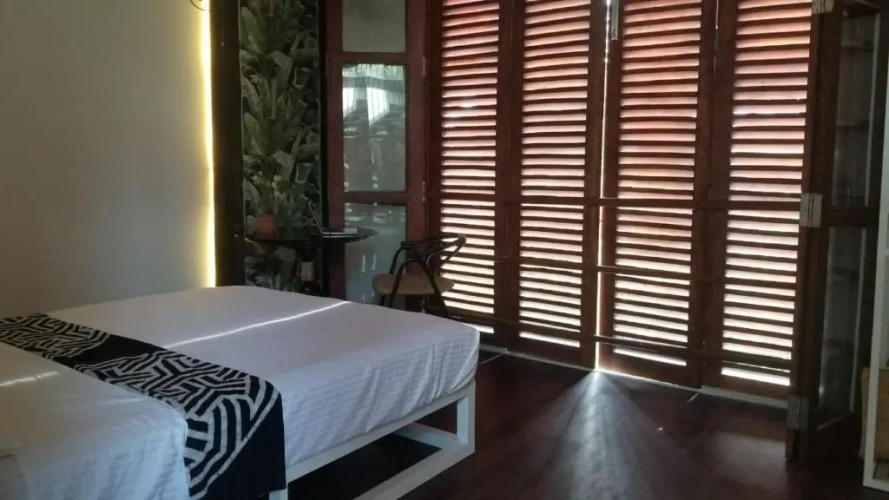 Standard Triple room with garden view