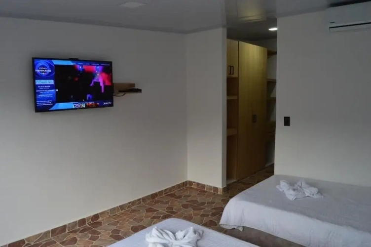 Deluxe Triple room with balcony and with garden view